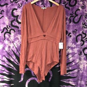Charlotte Russe rose deep V body suit - size L NWT